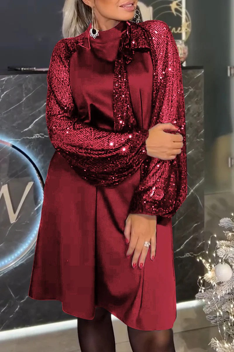 Damen Schickes Cocktailkleid mit glitzernden Puffärmeln und eleganter Schleife Heidi-Mode