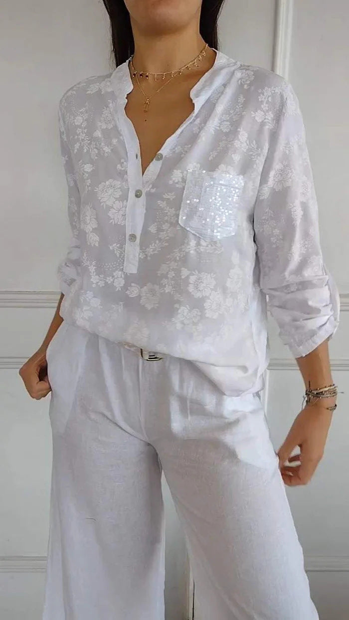 Damen Bluse mit floralem Design und funkelnden Pailletten Heidi-Mode
