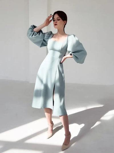 Damen Midikleid mit voluminösen Ärmeln und elegantem V-Ausschnitt Heidi-Mode