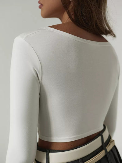 Damen Cropped Langarmshirt mit knotenförmigem Design und figurbetonender Passform Heidi-Mode