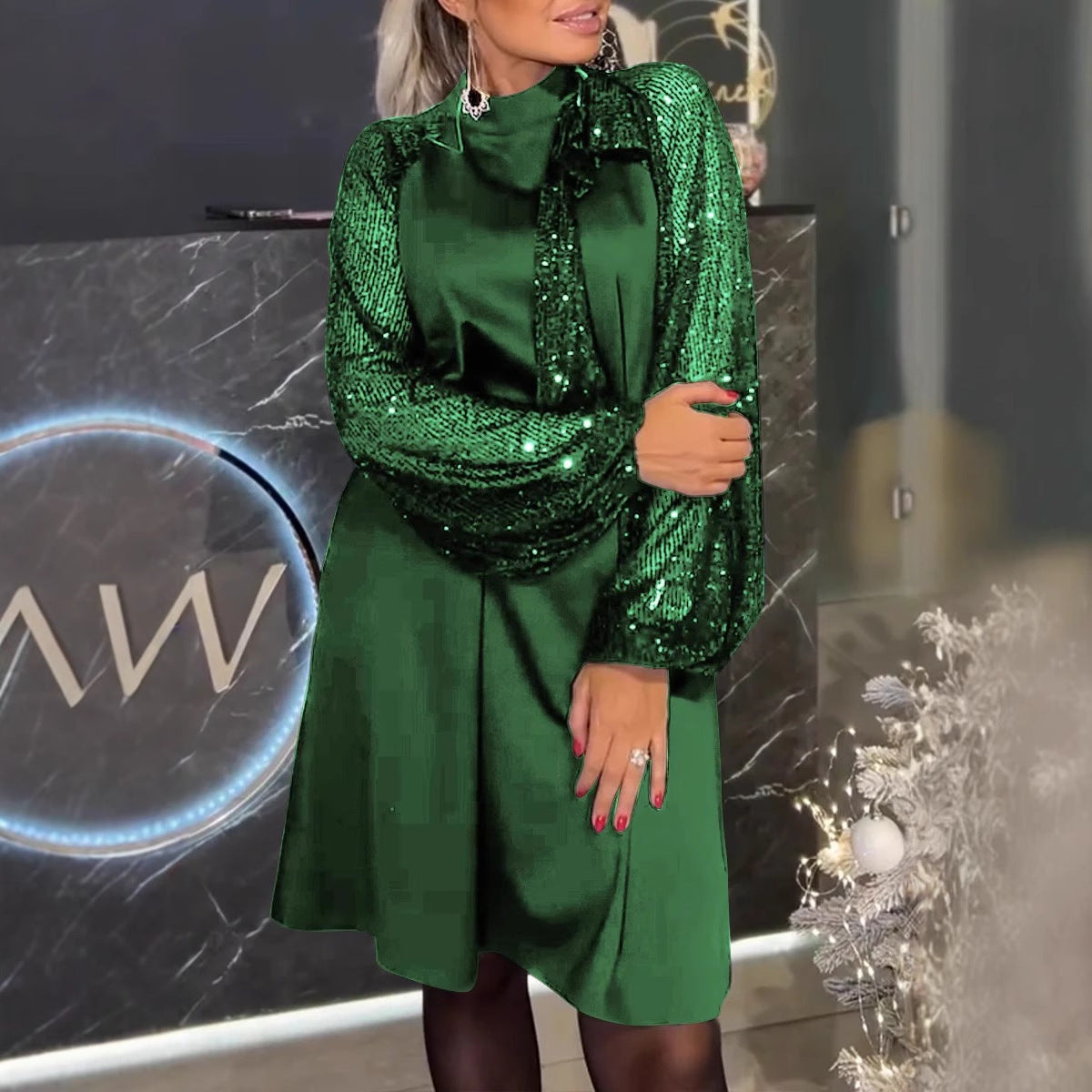 Damen Schickes Cocktailkleid mit glitzernden Puffärmeln und eleganter Schleife Heidi-Mode
