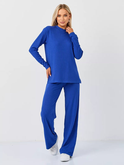 Damen cropped Langarmshirt mit modernem Knotendesign und feiner Rippstruktur Heidi-Mode